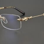 chrome hearts gold rimless cross glasses